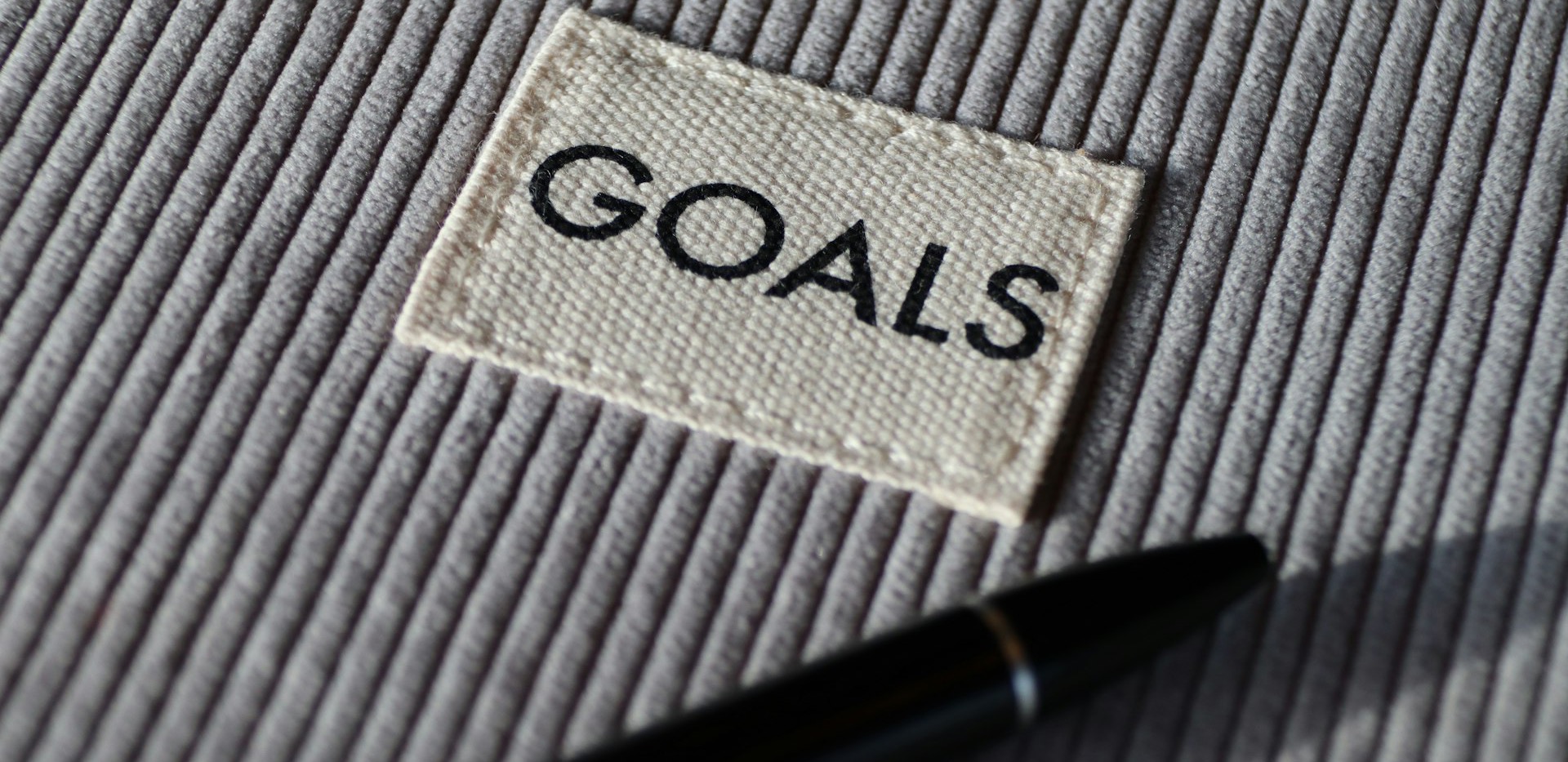 black and silver pen on gray textile